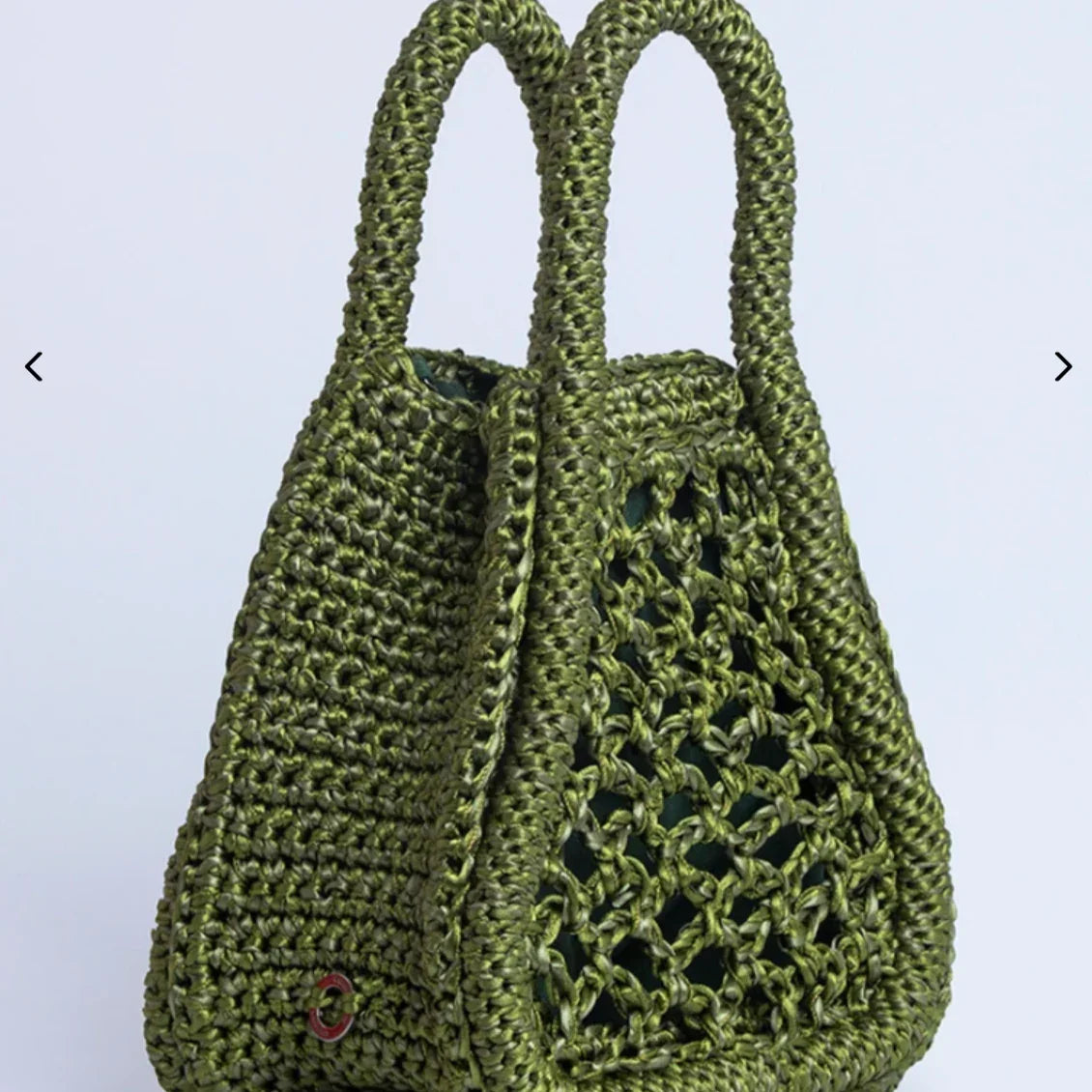 Handcrafted olive green woven tote bag with double handles and open mesh side panel