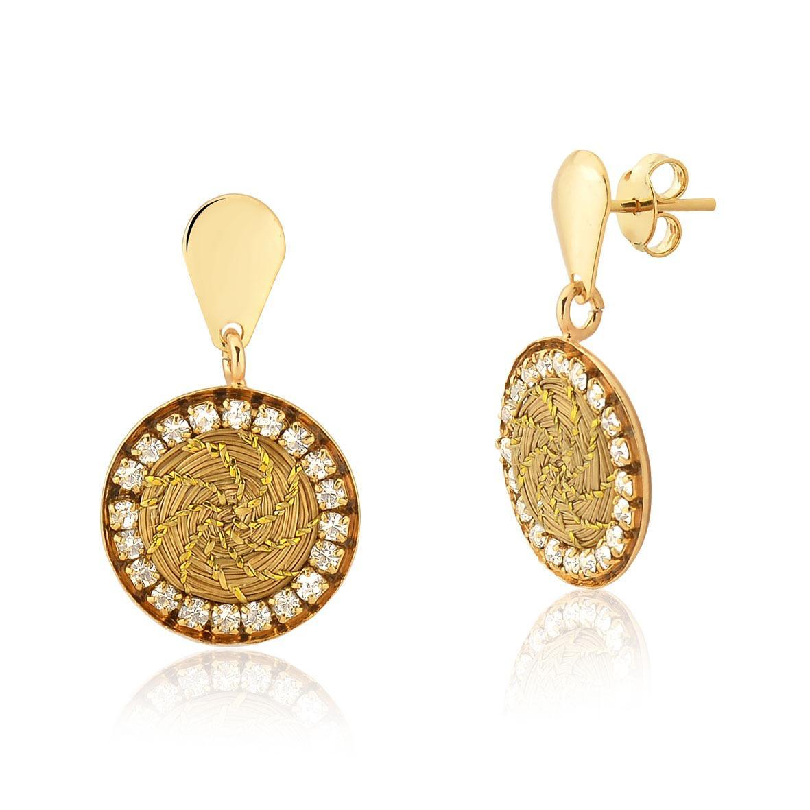 Gold drop earrings with woven circular center and zirconia crystal border