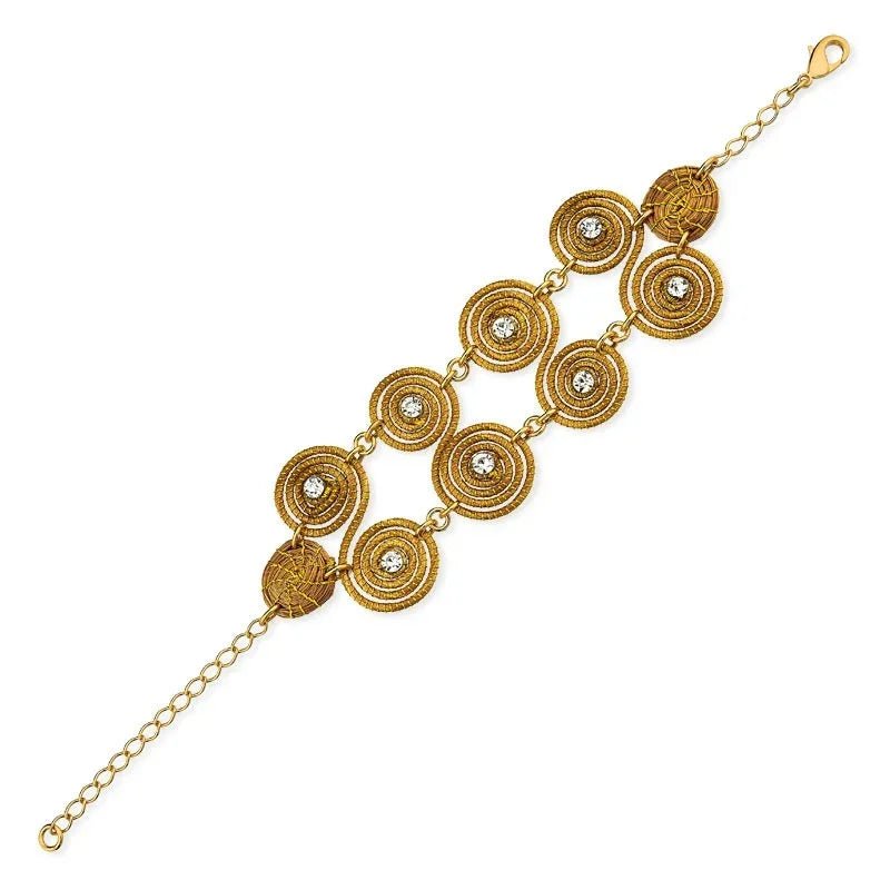 Handcrafted golden grass bracelet with circular mandala designs and zirconia accents