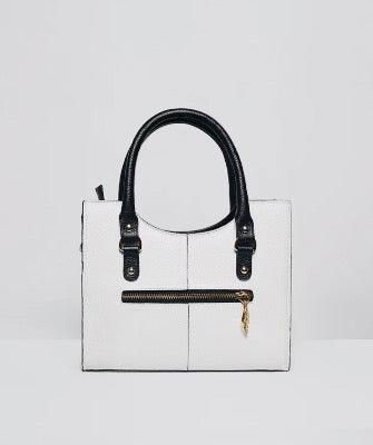 Back view of the Flora Bag. White in colour with a horizontal zip pocket across the middle.